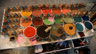 Supplies of coloured sand at Al-Awawda's shop. Reuters