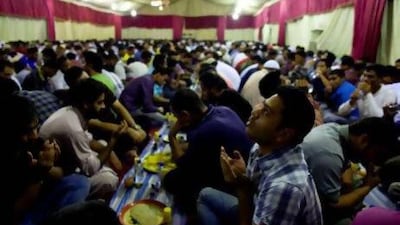 More than 300 workers broke fast together at the iftar tent at King Faisal Mosque, hosted by the Sharjah Islamic Bank. Christopher Pike / The National