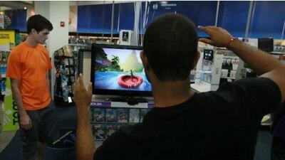 Microsoft's Kinect may work well for playing games, but not many people want to be interactive when it comes to watching TV. Joe Raedle / Getty Images / AFP