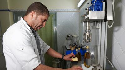 A technician fills bottles of argan oil at the Women's Agricultural Cooperative Taitmatine. Reuters