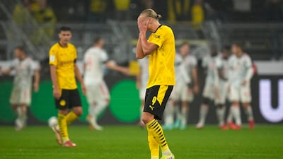 Dortmund's Erling Braut Haaland reacts after Robert Lewandowski opened the scoring for Bayern.