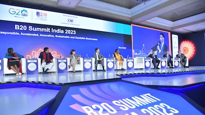 Kemi Badenoch, Britain's Business and Trade Secretary, far left, at a preview event to the G20 in New Delhi. Emirati foreign trade minister Dr Thani Al Zeyoudi is pictured with the microphone. Wam