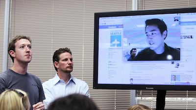 Facebook chief executive Mark Zuckerberg, left, watches a demonstration of the new Facebook video chat. Justin Sullivan / Getty Images / AFP