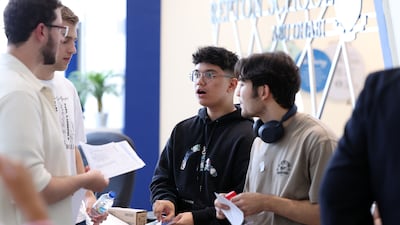 Timothy Tesluk gets his results at Repton School in Abu Dhabi. Chris Whiteoak / The National