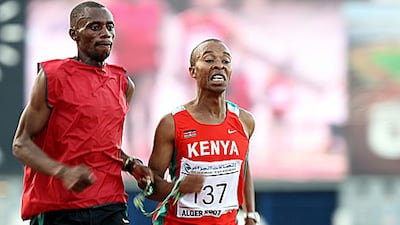 Henry Wanyoike, right, with his guide races to win the 5,000m silver medal at the ninth All-Africa Games in 2007.