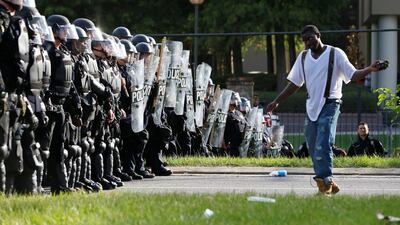 A demonstrator protests the shooting death of Alton Sterling near the headquarters of the Baton Rouge Police Department in Baton Rouge, Louisiana, U.S. Jonathan Bachman / Reuters