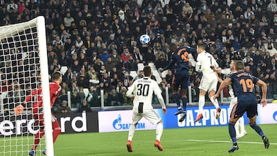 Valencia's Mouctar Diakhaby, centre, in action during the Uefa Champions League Group H match against Juventus at the Allianz Stadium in Turin. EPA