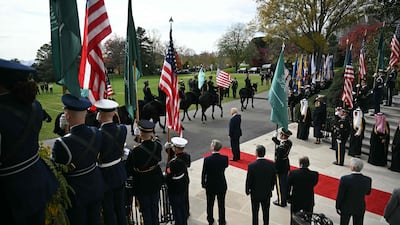 Mr Trump waits for the arrival of Prince Mohammed. AFP