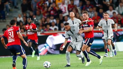 Paris Saint-Germain's Neymar and Lille's Ismaily Goncalves Santos in action. EPA