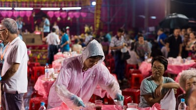Guests attend a banquet held during the performance. EPA