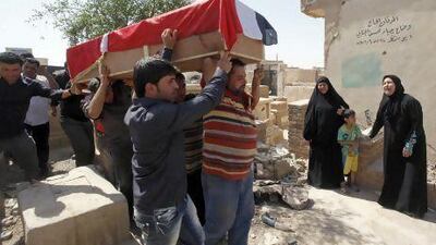 A 28-year-old bombing victim, Bashar Muhsin, is taken for burial in Najaf.