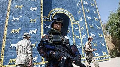 A military policeman stands guard outside a replica of the Ishtar Gate in Sept 2003. The gate, the eighth around the ancient city of Babylon, was originally built in 575BC by order of King Nebuchadnezzar II.