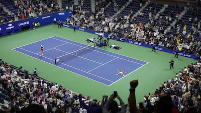 Carlos Alcaraz lies on the court after beating Jannik Sinner at the US Open. AFP