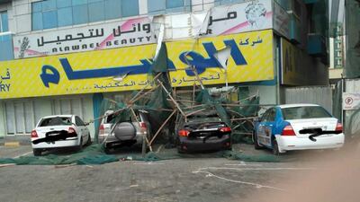 12 vehicles were damaged when the scaffolding fell. Courtesy Ajman Civil Defence