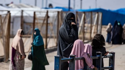 A woman with her children at Al Roj camp in north-eastern Syria, where relatives of suspected ISIS members have been held. AFP