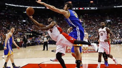 Golden State's Andrew Bogut guards Toronto's Josh Lucas.