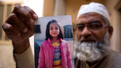 Mohammed Amin shows a picture of his 7-year-old daughter, Zainab Ansari in Kasur, Pakistan. A man convicted of raping and murdering Zainab, as well as seven other children, was sentenced to death on February 17, 2018. B K Bangash / AP Photo