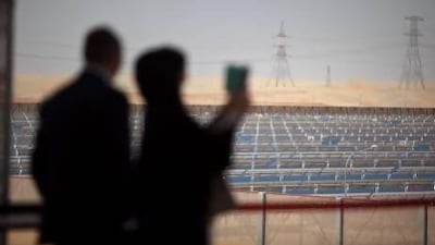 Guests and members of media take in the first views of Shams One following the inauguration of the solar power plant on Sunday, March 17, 2013. Silvia Razgova / The National
