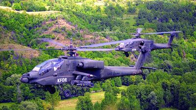 Two Emirati attack helicopters fly over the countryside bearing the KFOR markings of the Nato-led peacekeeping mission. Courtesy: Maj Gen Obaid Al Ketbi