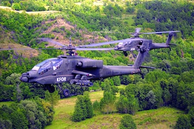 Two Emirati attack helicopters fly over the countryside bearing the Kfor markings of the Nato-led peacekeeping mission. Courtesy: Maj Gen Obaid Al Ketbi