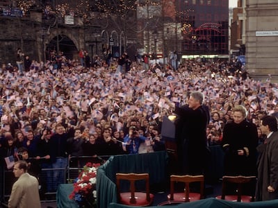 Bill Clinton was greeted by a flag-waving crowd when he visited Derry in 1995. Getty