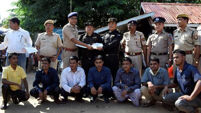 Seven Rohingya men, sitting, were sent across the India-Myanmar border at Moreh in Manipur state on October 4, 2018. Reuters