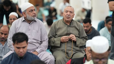 Worshippers attend morning prayers at Sheikh Hazza bin Sultan Mosque in Abu Dhabi. Pawan Singh for The National