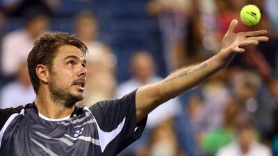Stan Wawrinka prepares to serve against Thomaz Bellucci during his second round match at the US Open on Wednesday. Streeter Lecka / Getty Images / AFP / August 27, 2014
