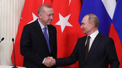 Russian President Vladimir Putin (R) and Turkish President Recep Tayyip Erdogan shake hands during a joint news conference following their talks in the Kremlin on Thursday. EPA