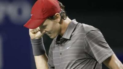 Tomas Berdych reacts after winning his semi-final match against Andy Roddick at the Japan Open.
