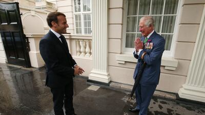 Britain's Prince Charles greets French President Emmanuel Macron at Clarence House in central London as he arrives for a visit to mark the 80th anniversary of former French president Charles de Gaulle's appeal to French people to resist the Nazi occupation during World War II. AFP