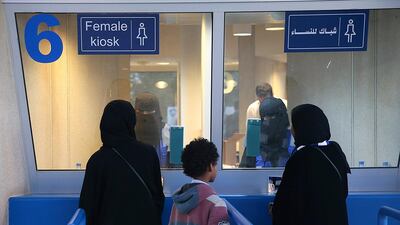 Women buy tickets from a designated kiosk to attend a Saudi league football match between Al Hilal and Al Ittihad at King Fahd Stadium in Riyadh, Saudi Arabia, on January 13, 2018. EPA