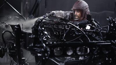 A worker paints a truck chassis at the Mack Trucks facility in Pennsylvania. US industry earnings may be downbeat. Bloomberg