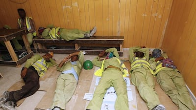 Construction workers in Dubai enjoy a respite from the heat on the first day of the compulsory summer midday break. Jeffrey E Biteng / The National