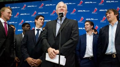 Donald Fehr, centre, of the NHL Players' Association is flanked by hockey stars as he speaks to the press following talks over a player lockout