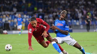 Liverpool's Virgil van Dijk fights for the ball with Napoli forward Victor Osimhen in the Champions League. AFP