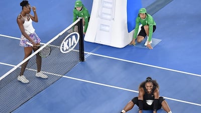Serena Williams falls to the ground after winning the Australian Open final. Andy Brownbill / AP Photo