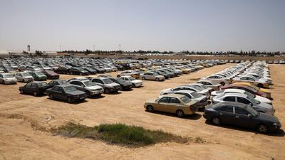 Cars confiscated from people who violated a curfew are seen in a car park outside Amman, Jordan. Reuters
