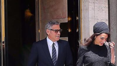 Amal Clooney and her husband in Rome, Italy. Courtesy of Versace.
