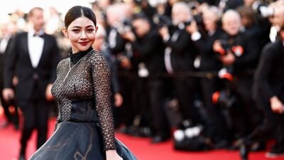 Cambodian actress Yubin Shin wearing a satin ballgown from Cinco's Japan-inspired spring/summer 2024 collection. AFP