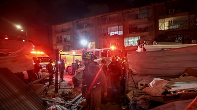 Israeli rescue teams work at the scene where Iranian ballistic missiles hit residential buildings in Bat Yam. According to emergency service Magen David Adom, paramedics pronounced the death of a woman about 60 years old and provided medical care to a total of 65 injured. EPA
