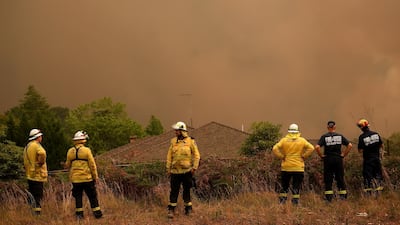 New South Wales Rural Fire Service officers watch as the Grose Valley Fire approaches Kurrajong Heights, NSW. EPA
