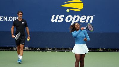 Patrick Mouratoglou, left, who coaches Serena Williams, says in-match coaching should be allowed in tennis to help the sport's popularity. AP Photo