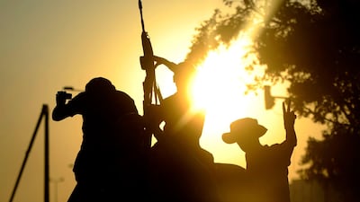 A rebel flashes the V-sign for victory during celebrations after rebel forces overran Libyan leader Moamer Kadhafi's fortified Bab al-Azizya headquarters in the capital Tripoli, following heavy fighting on August 23, 2011. AFP PHOTO/FILIPPO MONTEFORTE