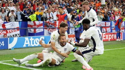 Harry Kane of England celebrates scoring his team's second goal with teammates. Getty Images