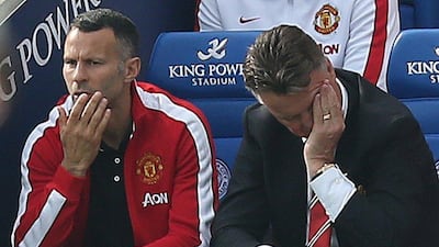 Manchester United manager Louis van Gaal, right, reacts during his side's Premier League loss to Leicester City on Sunday, as assistant Ryan Giggs, left, looks on. Kieran Galvin / EPA / September 21, 2014 DataCo_Terms_and_Conditions.pdf