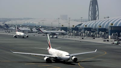 An Emirates airline passenger jet taxis on the tarmac at Dubai International The hub reported a year-on-year rise in passenger numbers for October. Kamran Jebreili / AP