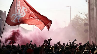 Liverpool fans with flares outside the stadium. Reuters
