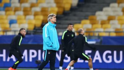 Manuel Pellegrini manager of Manchester City looks on as players perform drills during a Manchester City training session ahead of their UEFA Champions League round of 16 match against Dynamo Kiev at the Olympic Stadium on February 23, 2016 in Kiev, Ukraine. Michael Steele/Getty Images