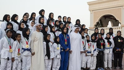 Sheikh Mohammed bin Zayed, Crown Prince of Abu Dhabi and Deputy Supreme Commander of the Armed Forces, and Sheikh Nahyan bin Zayed, Chairman of the Board of Trustees of Zayed bin Sultan Al Nahyan Charitable and Humanitarian Foundation, stand for a photograph with winners of the Abu Dhabi World Professional Jiu-Jitsu Championship 2016, seen during a Sea Palace barza. Ryan Carter / Crown Prince Court - Abu Dhabi